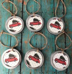 four christmas ornaments with red cars on them