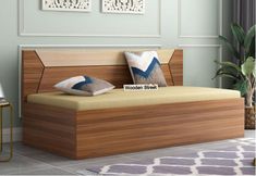 a modern daybed with two pillows on it