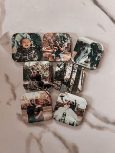 four square coasters with pictures of people and dogs on them sitting on a marble surface