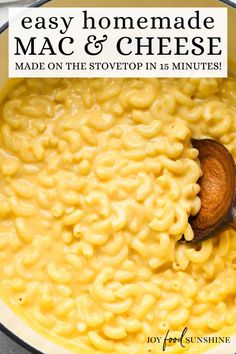 macaroni and cheese in a pot with a wooden spoon