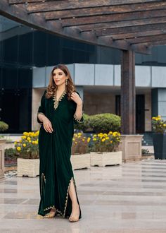 Deep forest green Velvet Kaftan delicately handworked with dabka, nakshi and zardozi on the neckline, shoulder slits, sleeves and front and back hemline and side slits. Kaftan Party Wear, Green Kaftan With Resham Embroidery For Festive Season, Green Kaftan With Resham Embroidery For Festive Occasions, Festive V-neck Kurta With Dabka Detailing, Festive Green Kaftan With Resham Embroidery, Green Festive Kaftan With Resham Embroidery, Festive Green Dabka Kaftan, Evening Kurta With Dupatta In Traditional Drape, Green V-neck Kaftan For Festive Occasions