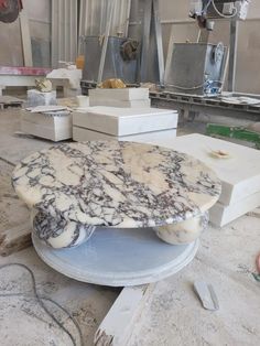 marble table top being worked on in a factory