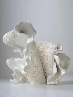 a white sculpture sitting on top of a table