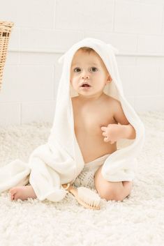 baby boy wrapped in KeaBabies Bamboo Hooded Towel also featured is the Keababies wooden hairbrush Baby Hooded Towel, Baby Hooded Bath Towel, Luxe Baby, Registry Ideas, Baby Bamboo, Time Routine, Baby Bath Towel, Baby Washcloth, Hooded Bath Towels