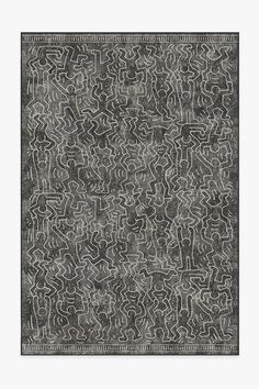 a black and white rug with an intricate design on the bottom, in grey tones