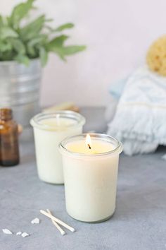 two candles sitting next to each other on a table