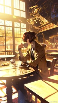 a man sitting at a table drinking coffee