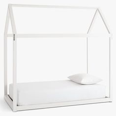 a bed with a white frame and pillows on it's bottom half, in front of a white background