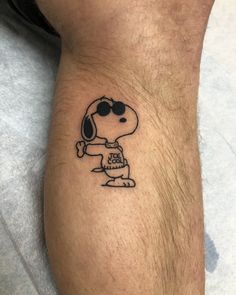 a small tattoo on the leg of a man