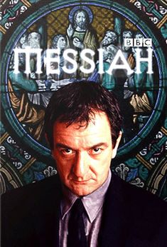 a man in a suit and tie standing next to a stained glass window with the words messiah on it