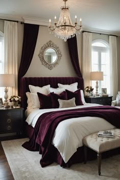 a bedroom with a large bed, chandelier and purple bedspread in it