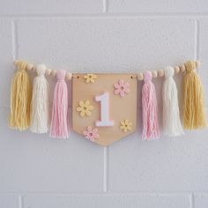 A perfect little high chair garland for those Berry first birthday photoshoots and cake smash's. DETAILS pine wood flag pink & white acrylic number 1 feature pink & yellow acrylic daisies handmade wool tassles flag is 13cm x 10cm fits to a standard size high chair garland (easy to fit with some household removable hooks - comes with) SHIPPING  We currently ship within Australia and Internationally to USA, NZ and CANADA. Australia Post has been experiencing delays during this difficult time and p Daisy Boho Birthday, High Chair Garland, First Birthday High Chair, 1st Birthday Decor, Daisy Crown, Groovy Daisy, Boho Crown, Birthday High Chair, Felt Crown