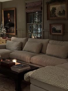 a living room filled with furniture and a christmas tree