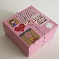 an open pink box with pictures on it