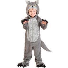 a little boy dressed in a cat costume