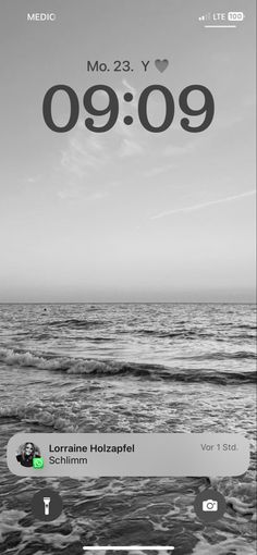 an iphone screen showing the time and location of two people in the ocean, one person is