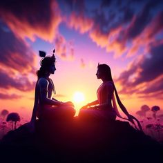 two women sitting on top of a rock with the sun setting behind them