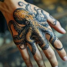 an octopus tattoo on the palm of someone's hand