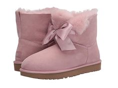 UGG Gita Bow Mini Boot (Pink Crystal) Women's Pull-on Boots A cute little gift of a boot. Pull-on mini boot in twinface sheepskin with a sueded upper and fur lining. Fixed satin bow adorns the front. UGGpureâ? wool insole. Polyester binding. Lightweight and flexible Treadlite by UGGâ? outsole. Real sheep or lamb fur from Australia Ireland the United Kingdom or the United States is artificially dyed and treated. Imported. Measurements: Heel Height #UGG #Shoes #Boot #CasualPull-on #Pink Ugg Boots With Bows, Expensive Outfits, Cute Uggs, Winter Boots For Women, Pink Uggs, Stockholm Stil, Outfits Dressy, Pink Boots, Fresh Shoes