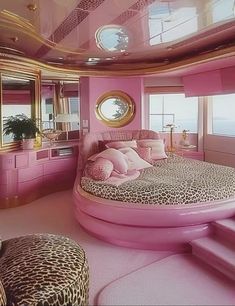 a pink bedroom with leopard print on the bed