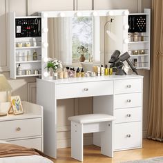 a white vanity with lights on it in a bedroom