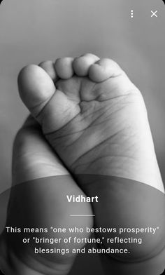 a black and white photo of a baby's foot with the caption vidhart