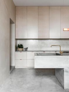 an instagramted photo of a kitchen with white cabinets