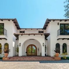 a large white house with lots of windows