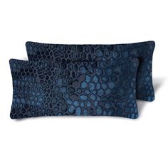 two blue pillows on white background with black circles and dots in them, one is made out of fabric