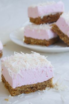 four pieces of cake sitting on top of a white plate next to another piece of cake