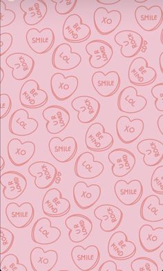 a pink background with hearts and the word smile on it's side, as well as