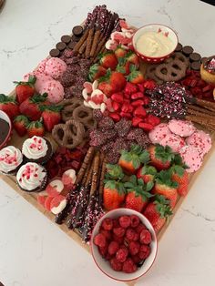 a table topped with lots of different types of desserts