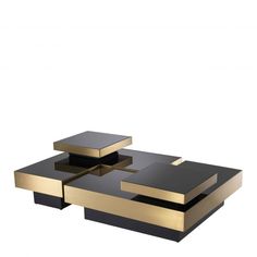 a black and gold coffee table sitting on top of a white floor