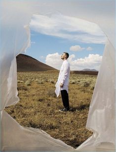 a man standing in the middle of a field