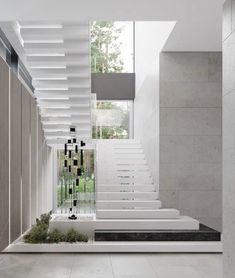 the stairs in this modern house are made of white marble