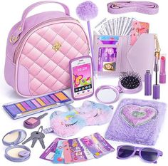 the contents of a pink purse are neatly organized and ready to be used as an accessory