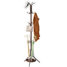 a coat rack with umbrellas and hats hanging from it's sides on a white background