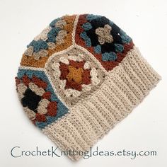 a crocheted beanie with multicolored squares on the front and sides