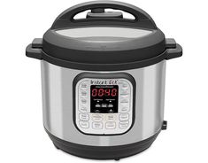 an electric pressure cooker with the timer on it's side and lid open