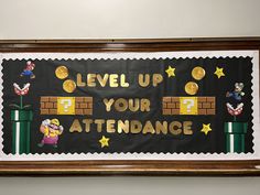 a sign that says level up your attendance in front of a wall with mario and luigi on it