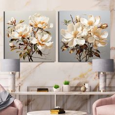 two paintings of flowers on a wall in a living room