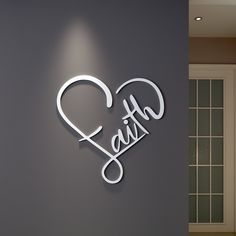 a sign that says faith on the side of a wall