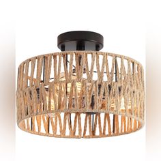 the light fixture is made out of wood and has an intricate design on it's side