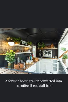 a horse trailer converted into a coffee and cocktail bar with plants on the counter top