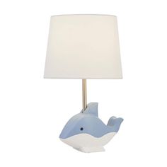 a blue whale lamp with a white shade