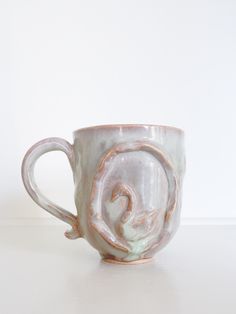 a ceramic cup with a horse on it