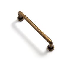 an antique brass door handle on a white background