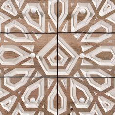 an abstract design made out of wood and white paint on the wall, with three different angles