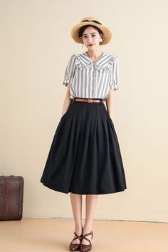 Expertly crafted and designed for versatility, this Black A Line pleated Midi Circle Skirt with Pockets is sure to become a staple in your wardrobe. The A-line silhouette flatters any body type while the pleated design adds subtle volume and movement. With the added convenience of pockets, this skirt is both stylish and practical for your everyday needs. DETAIL* 50% linen , 50% cotton* No lining* Seam pockets* Right zipper closure* Below Knee Length* Circle skirt, skater skirt* Wash by hand or machine with cold water* More colors SIZE GUIDEGet your body measurement with our Size Guide and leave me the information we need bellow, they will help us check the size and ship your package.WaistHipHeightWeightPhone number MODEL SIZEBust:85 cm(33.4")Waist:67 cm(26.7")She wears size US 2CUSTOM MADE Midi Circle Skirt, Tailored Clothes, Body Measurement, Skirt With Pockets, Circle Skirt, Skirts With Pockets, Black Skirt, Body Measurements, Skater Skirt