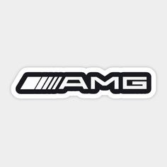 the amg logo sticker is shown in black and white on a gray background